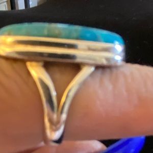 One round and one square turquoise rings